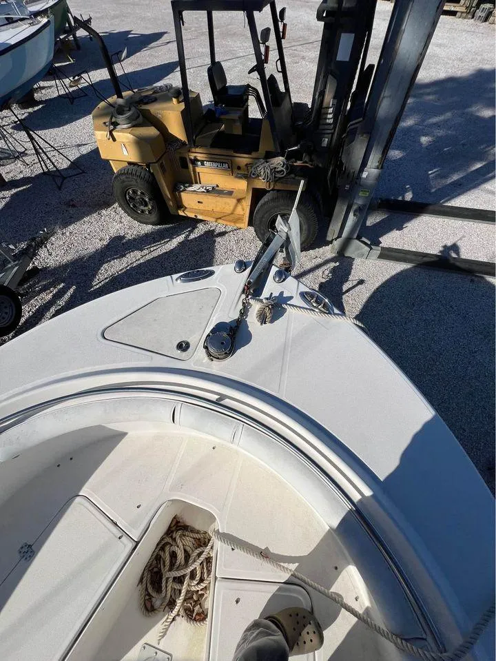 Slide: The Image of 2007 Edgewater 268CC boat being lifted by a Caterpillar forklift. - 5