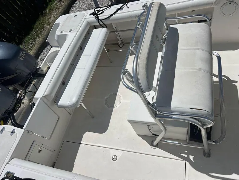 Slide: The Image of 2007 Edgewater 268CC boat interior with seating and storage compartments. - 6