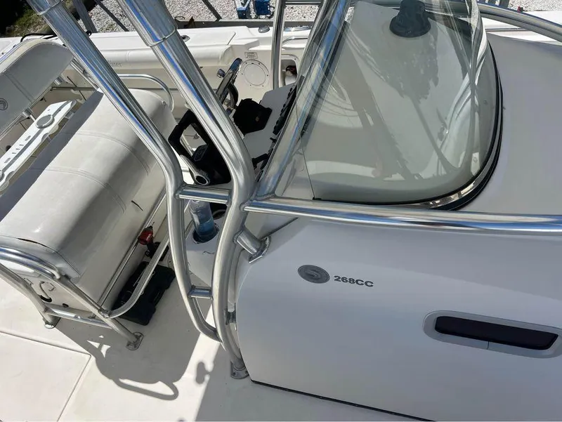 Slide: The Image of 2007 Edgewater 268CC boat interior with seating and control console. - 7