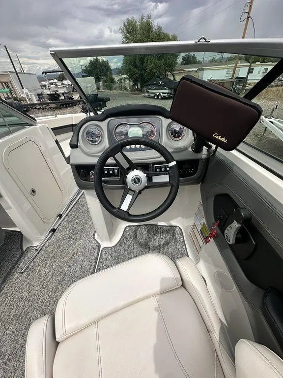 Slide: The Image of 2018 Chaparral 203 VR boat cockpit with steering wheel and dashboard. - 11