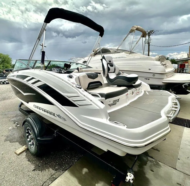 Slide: The Image of 2018 Chaparral 203 VR boat with sleek design on a trailer, ready for adventure. - 5