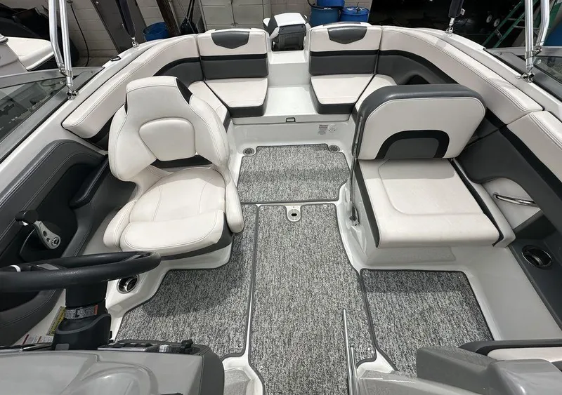 Slide: The Image of 2018 Chaparral 203 VR boat interior with white and gray seating. - 7