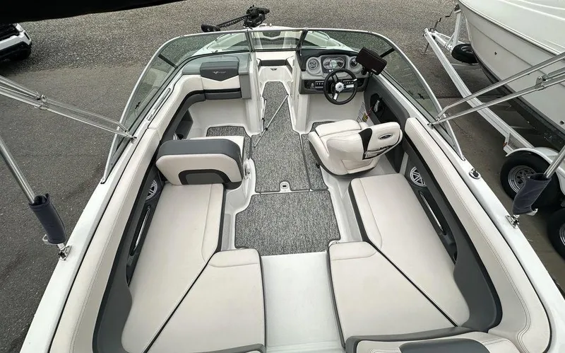 Slide: The Image of 2018 Chaparral 203 VR boat interior with spacious seating and modern dashboard. - 9