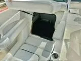 Slide: The Image of 2012 Sea Ray 260 SD boat interior with open storage compartment. - 11