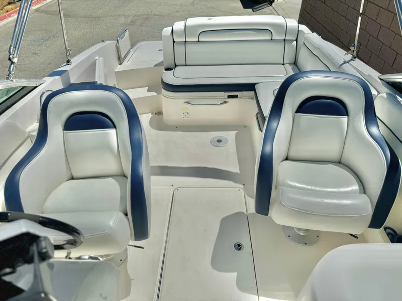 Slide: The Image of Interior of 2012 Sea Ray 260 SD boat with white and blue seating. - 12