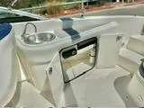 Slide: The Image of 2012 Sea Ray 260 SD boat interior with sink and storage compartments. - 17