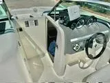 Slide: The Image of 2012 Sea Ray 260 SD boat interior with steering wheel and dashboard. - 23