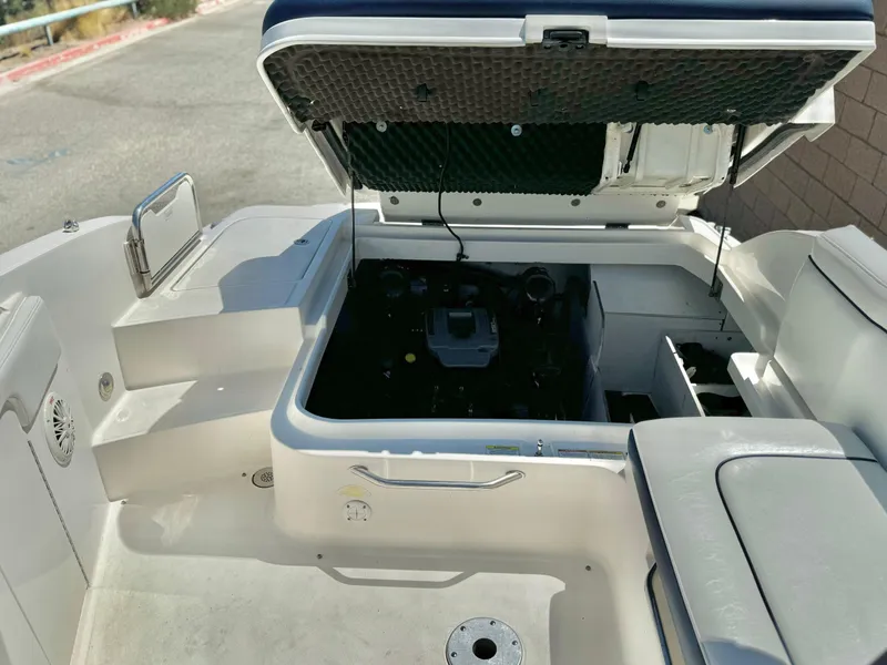 Slide: The Image of 2012 Sea Ray 260 SD boat engine compartment with open hatch. - 26