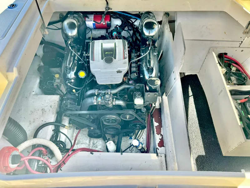 Slide: The Image of Engine compartment of 2012 Sea Ray 260 SD boat, showcasing detailed mechanical components. - 27