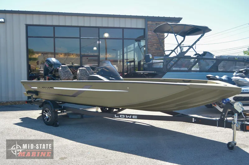 Slide: The Image of 2024 Lowe Outlet 20 boat on trailer at Mid-State Marine dealership. - 1