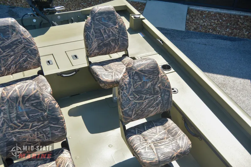 Slide: The Image of 2024 Lowe Outlet 20 boat with camo seats and spacious interior. - 17