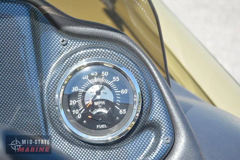 Slide: The Image of Close-up of 2024 Lowe Outlet 20 speedometer and fuel gauge. - 22