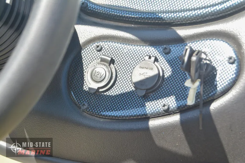 Slide: The Image of Close-up of the control panel in a 2024 Lowe Outlet 20 boat. - 24