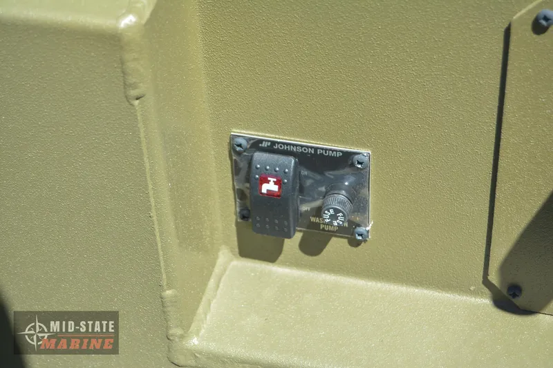 Slide: The Image of Control panel of a 2024 Lowe Outlet 20 boat with Johnson pump switch. - 26