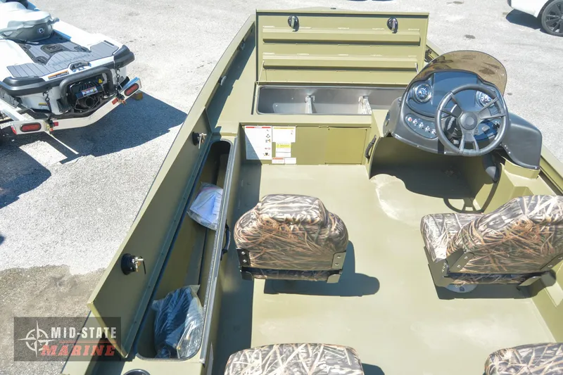 Slide: The Image of 2024 Lowe Outlet 20 boat interior with camo seats and steering console. - 27