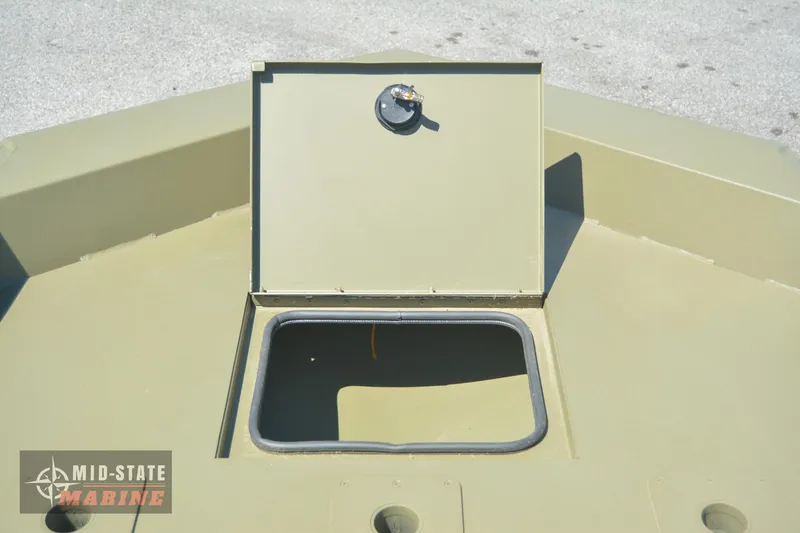 Slide: The Image of 2024 Lowe Outlet 20 boat storage compartment with open hatch. Mid-State Marine logo visible. - 28