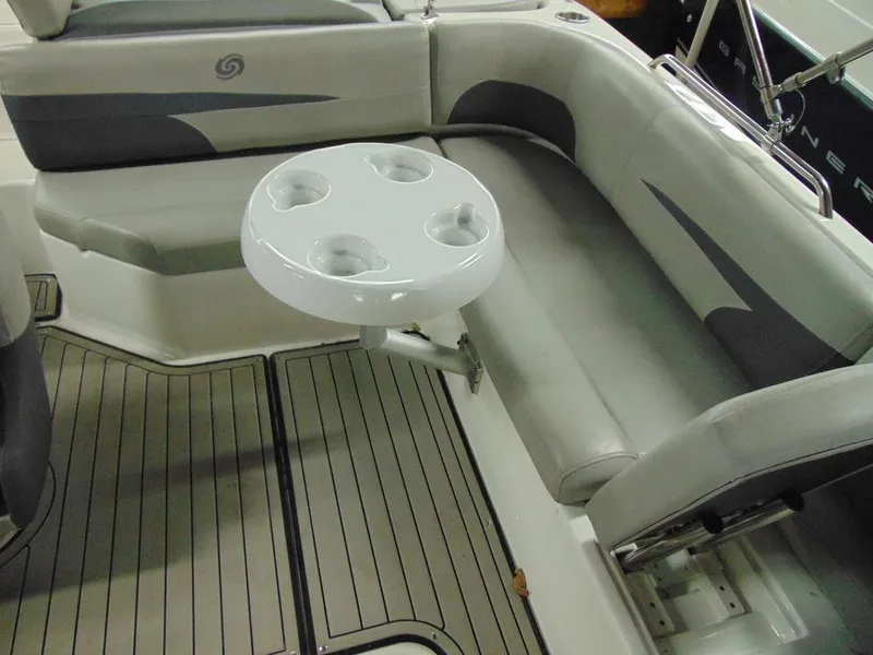 Slide: The Image of 2019 Hurricane SS 201 I/O boat interior with seating and cup holder table. - 10