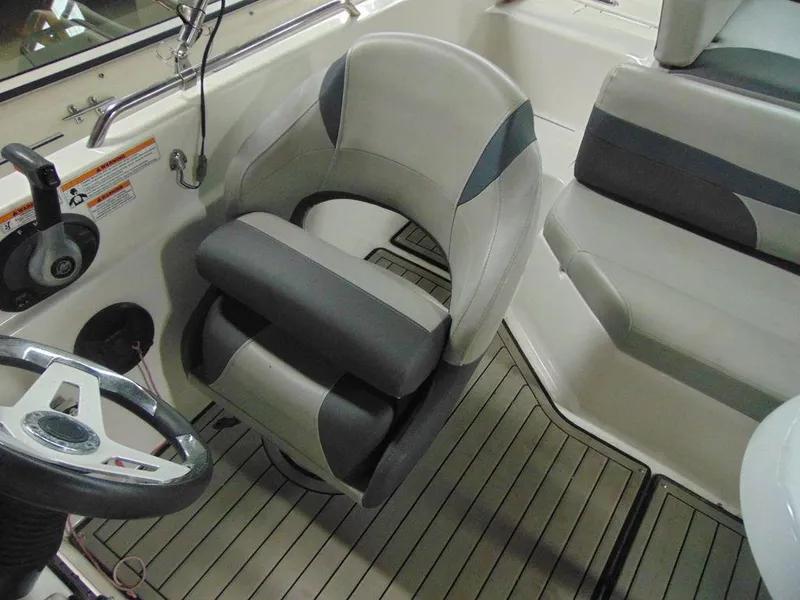 Slide: The Image of 2019 Hurricane SS 201 I/O boat interior with steering wheel and seating. - 13