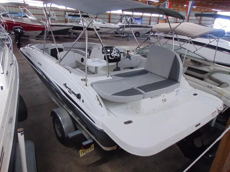 Slide: The Image of 2019 Hurricane SS 201 I/O boat with canopy in showroom. - 14