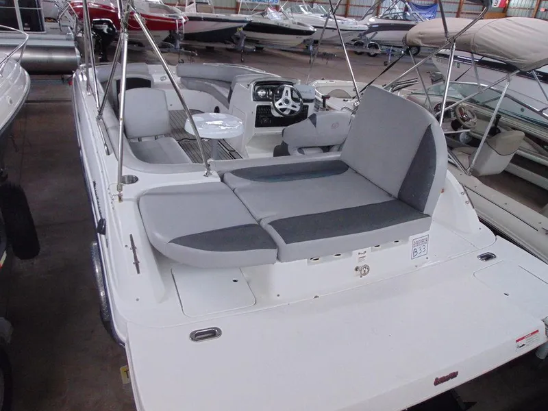 Slide: The Image of 2019 Hurricane SS 201 I/O boat interior with gray seating and steering console. - 3
