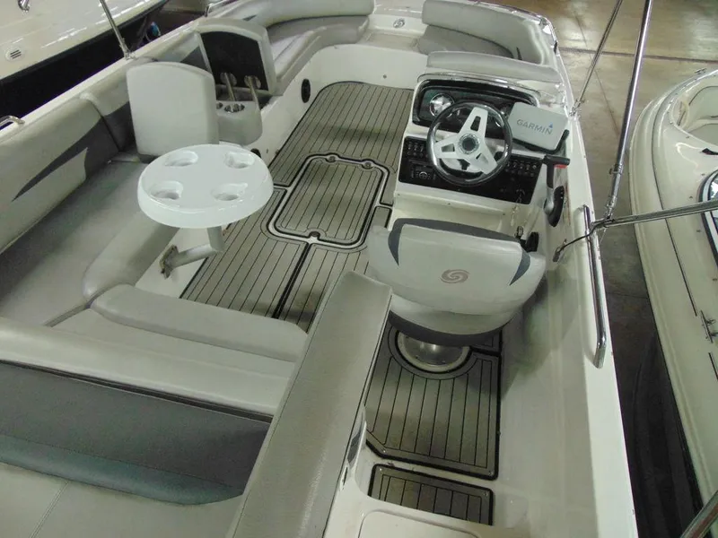 Slide: The Image of 2019 Hurricane SS 201 I/O boat interior with seating, steering wheel, and table. - 5