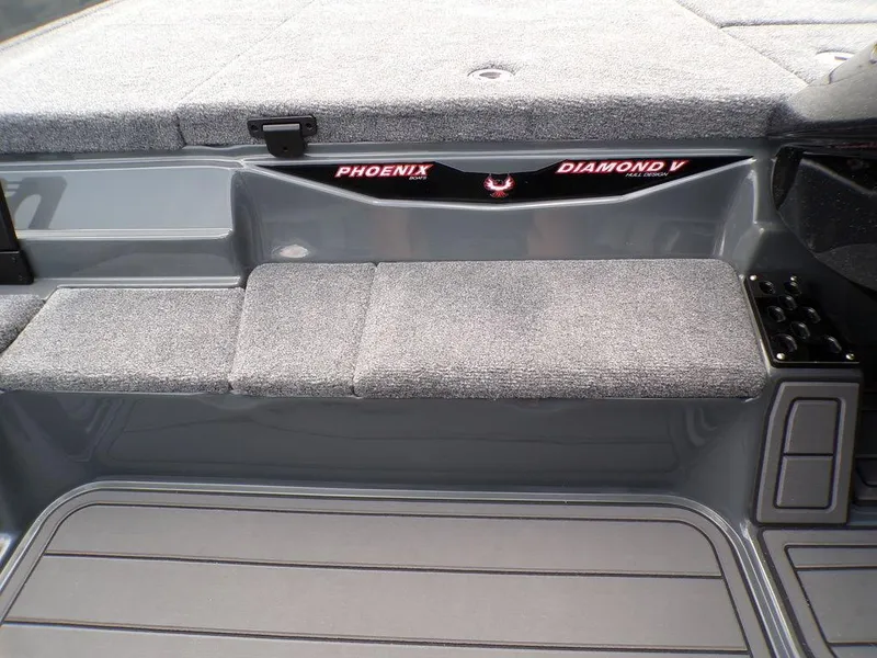 Slide: The Image of 2025 Phoenix 920 Elite boat interior with cushioned seating and sleek design. - 10