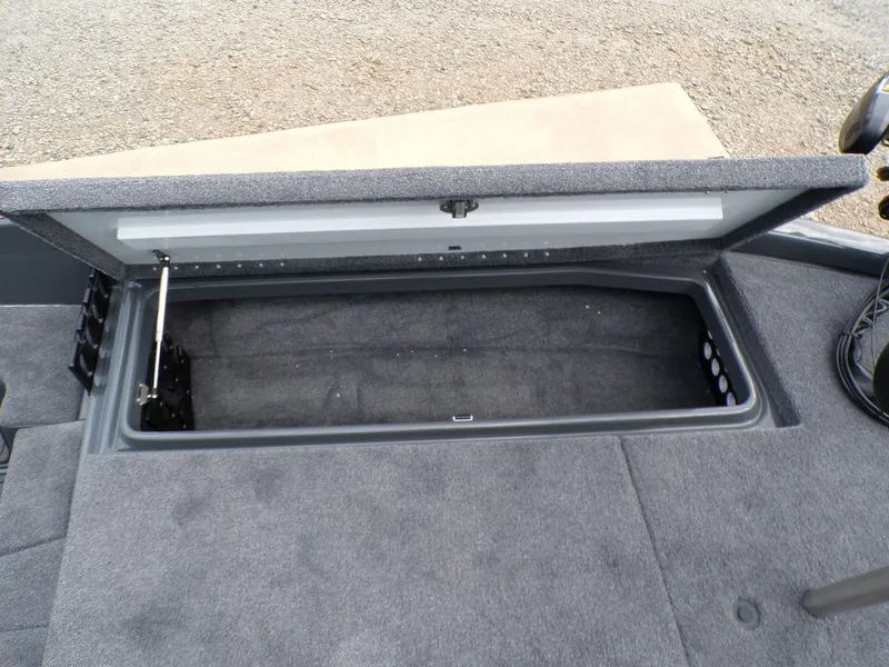 Slide: The Image of Open storage compartment in 2025 Phoenix 920 Elite boat. - 15