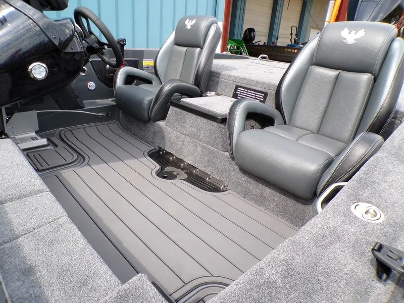 Slide: The Image of 2025 Phoenix 920 Elite boat interior with gray leather seats and sleek flooring. - 22