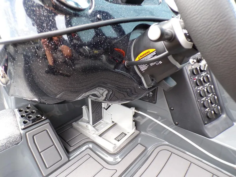 Slide: The Image of 2025 Phoenix 920 Elite boat dashboard with control panel and steering wheel. - 26