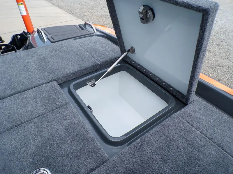 Slide: The Image of Open storage compartment in 2025 Phoenix 920 Elite boat. - 31