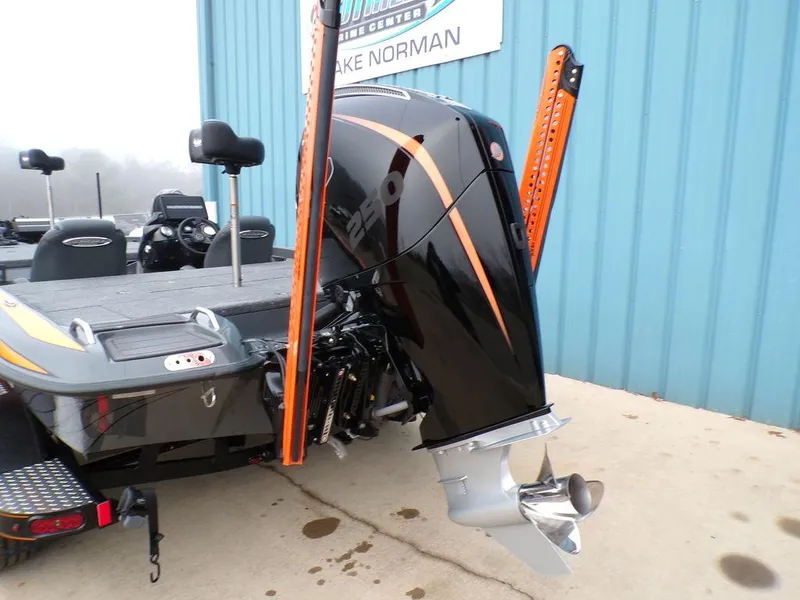 Slide: The Image of 2025 Phoenix 920 Elite boat with powerful outboard motor and sleek design. - 35