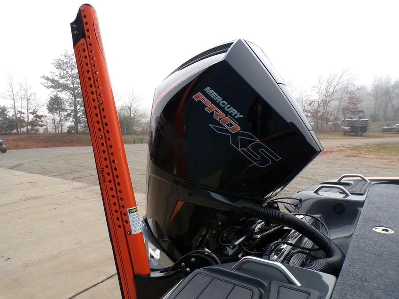 Slide: The Image of Phoenix 920 Elite 2025 boat with Mercury Pro XS engine, docked outdoors. - 38