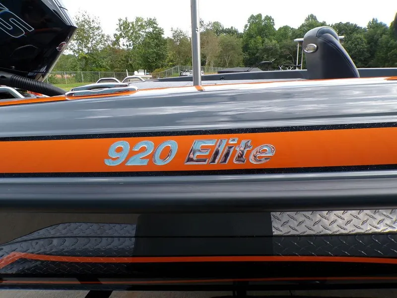 Slide: The Image of 2025 Phoenix 920 Elite boat with orange and gray detailing. - 7