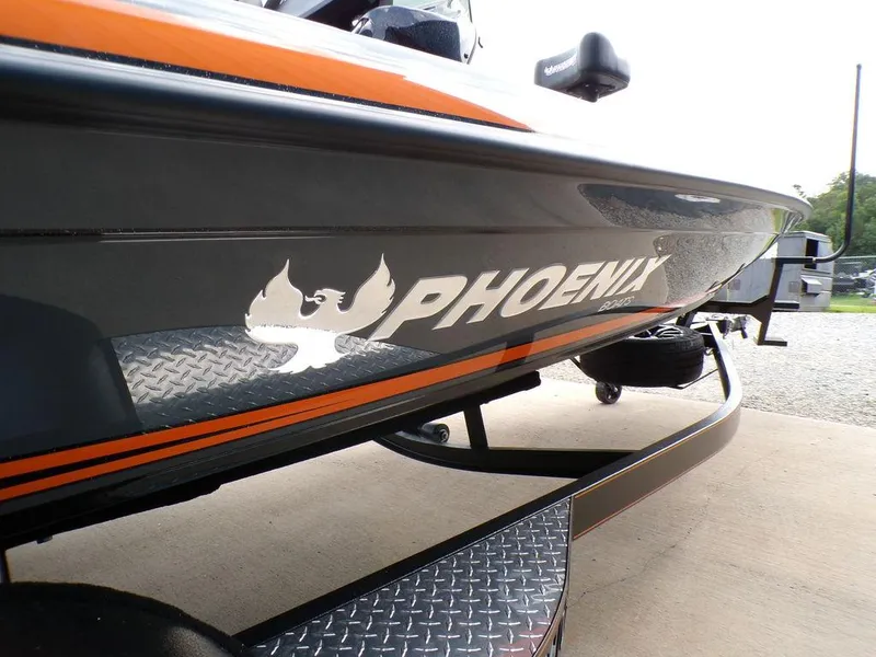 Slide: The Image of 2025 Phoenix 920 Elite boat with logo and sleek design on trailer. - 8