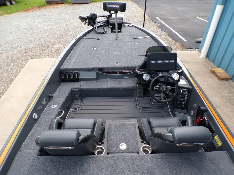 Slide: The Image of 2025 Phoenix 920 Elite boat interior with advanced navigation system and comfortable seating. - 9