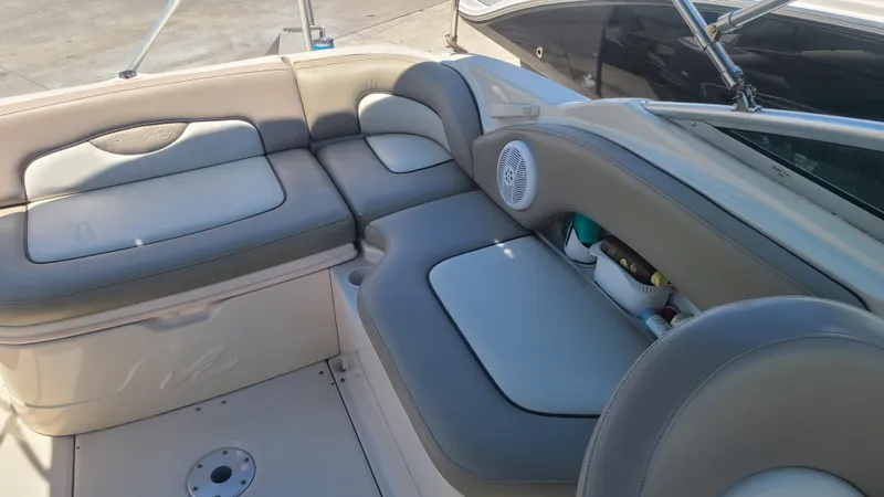 Slide: The Image of 2004 Sea Ray 270 Sundeck interior seating and storage compartments. - 10