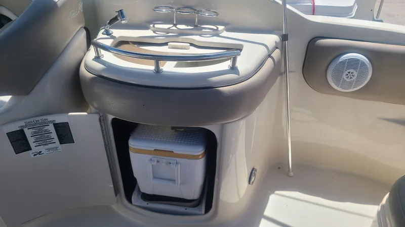 Slide: The Image of 2004 Sea Ray 270 Sundeck interior with cooler and sink. - 12