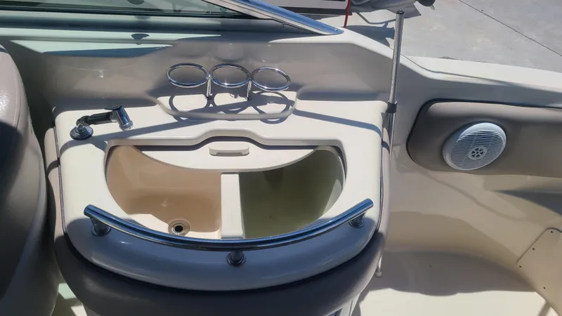 Slide: The Image of 2004 Sea Ray 270 Sundeck boat sink and cup holders. - 13
