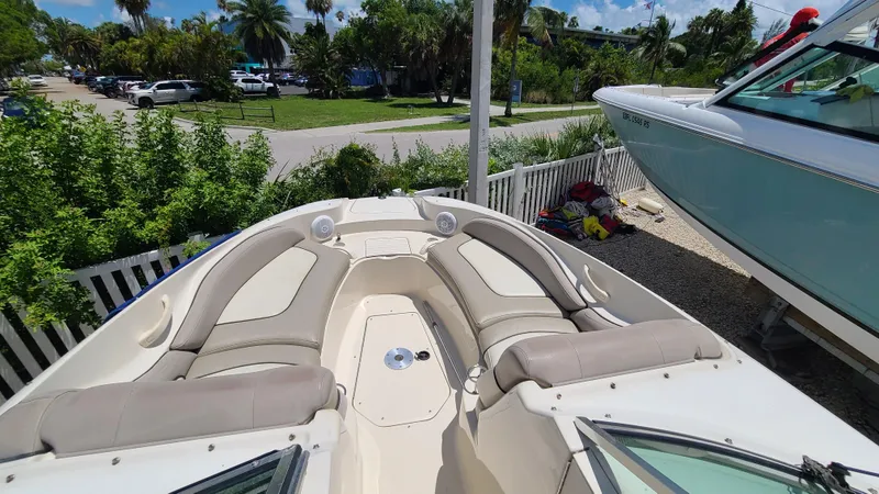 Slide: The Image of 2004 Sea Ray 270 Sundeck boat with spacious seating and scenic outdoor view. - 5
