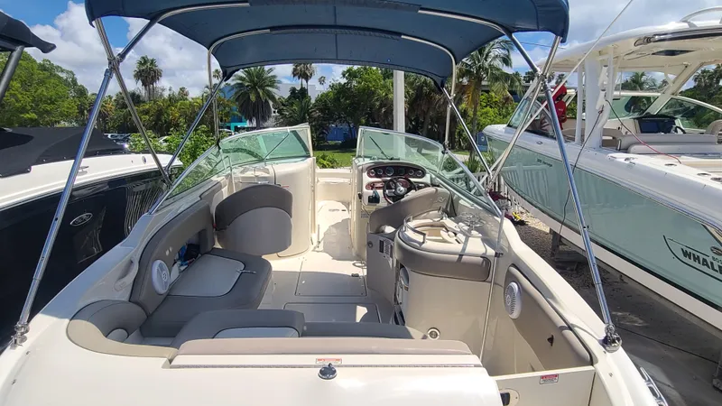 Slide: The Image of 2004 Sea Ray 270 Sundeck boat interior with seating and canopy. - 6