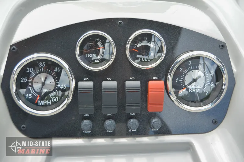 Slide: The Image of Dashboard of 2024 Lowe Ultra 200 Cruise boat with gauges and controls. - 17