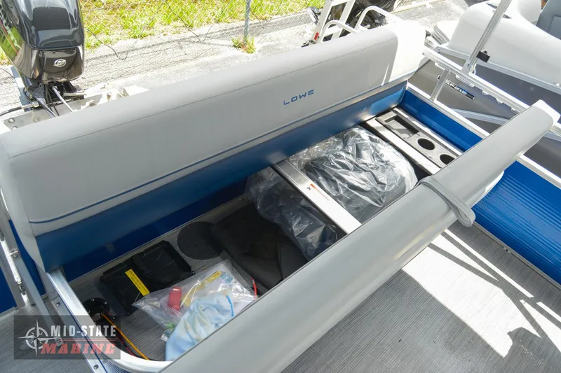 Slide: The Image of 2024 Lowe Ultra 200 Cruise boat interior storage compartment with open seat. - 22