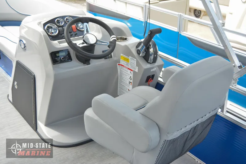 Slide: The Image of 2024 Lowe Ultra 200 Cruise boat helm with steering wheel and captain's chair. - 23