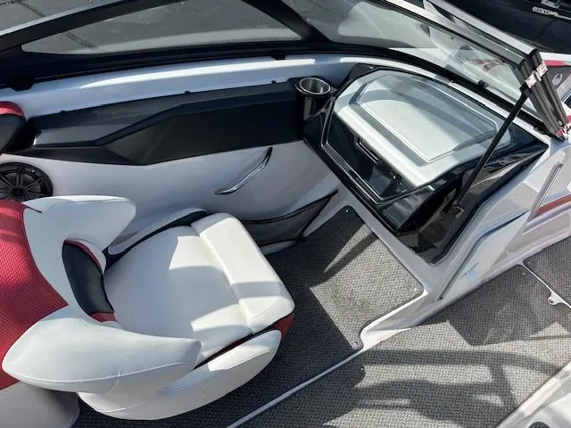 Slide: The Image of 2016 Scarab 215 HO Impulse boat interior with white and red seating. - 10