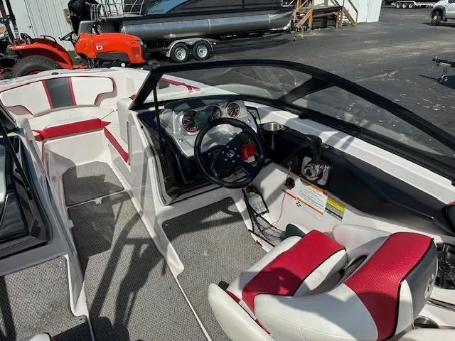 Slide: The Image of 2016 Scarab 215 HO Impulse boat interior with red and white seating. - 9