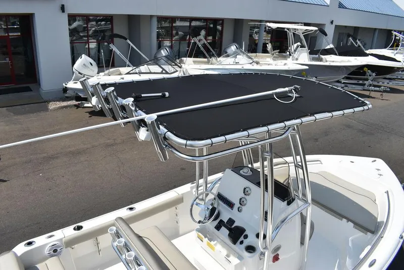 Slide: The Image of 2024 Key West 189 FS boat with T-top, parked at a dealership. - 10
