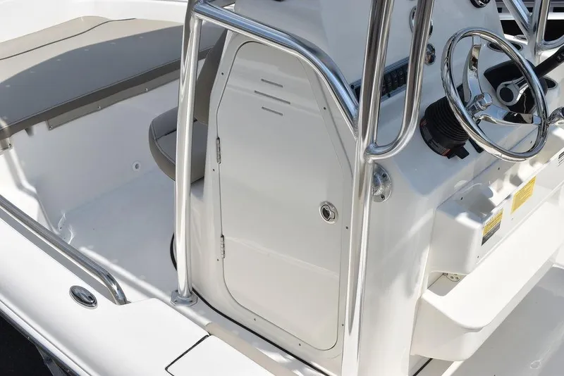 Slide: The Image of 2024 Key West 189 FS boat console with steering wheel and seating area. - 17