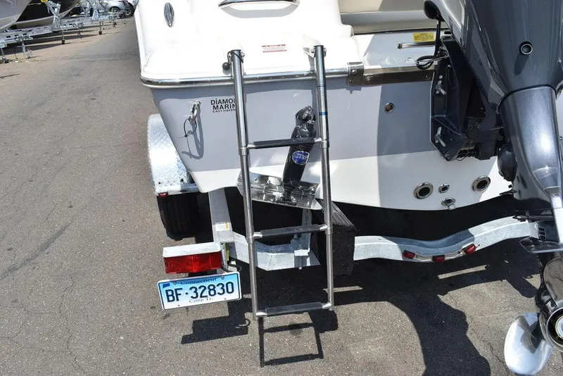 Slide: The Image of 2024 Key West 189 FS boat with ladder and trailer, rear view. - 18
