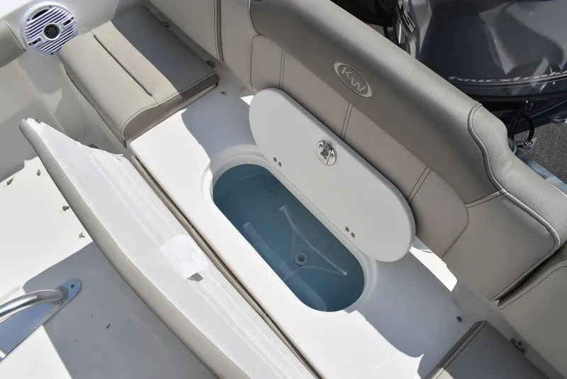 Slide: The Image of 2024 Key West 189 FS boat interior with storage compartment and cushioned seating. - 20