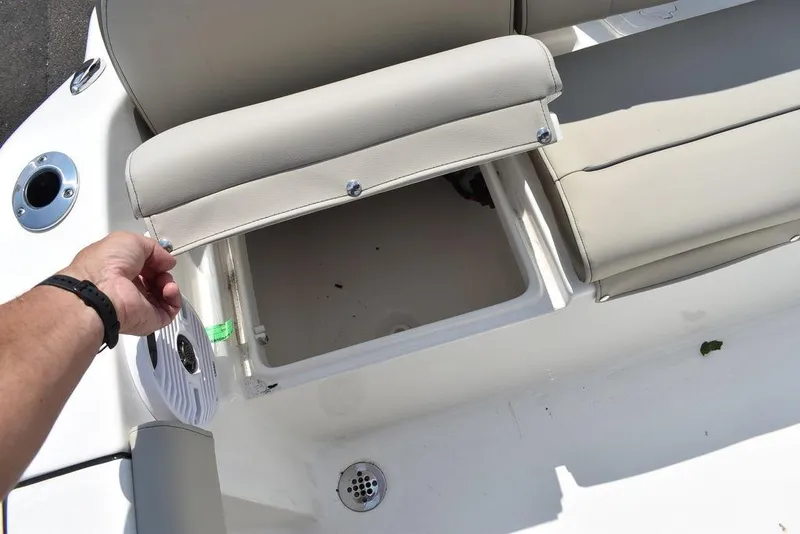 Slide: The Image of 2024 Key West 189 FS boat seat storage compartment open. - 22